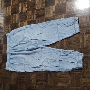 American Eagle loose fit will fit Large or X-Large woman